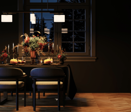 A festive dinner scene with a focus on the table decorations and with a window in the background.