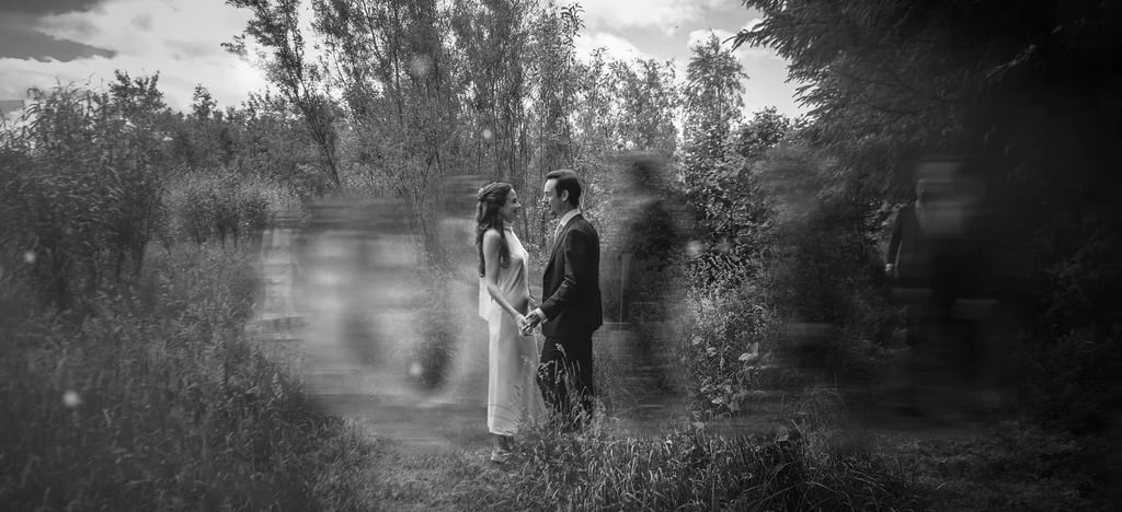 bride and groom walking toward each other in the countryside