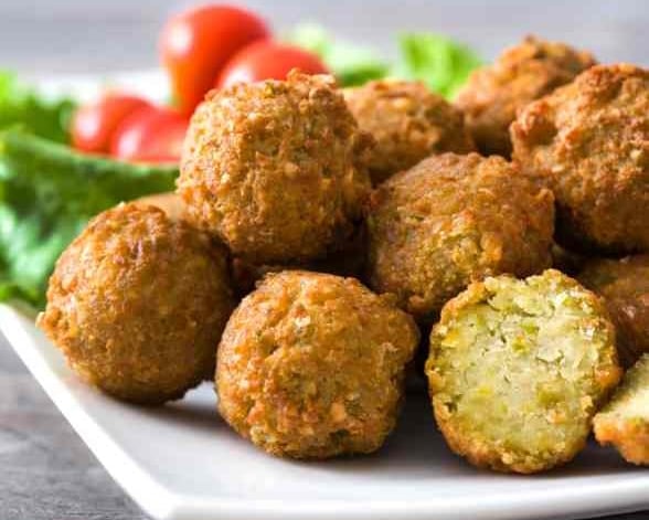 a white plate filled with falafel