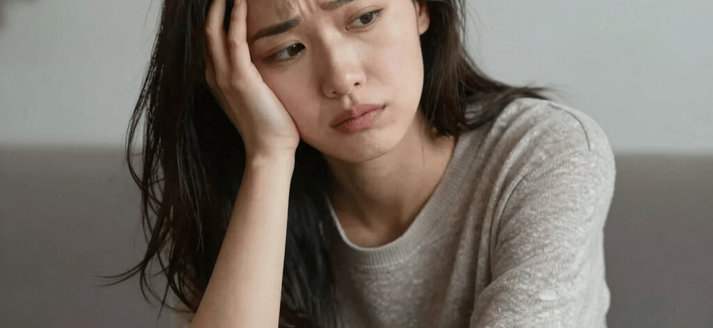 Woman holds a sign: sexual and spiritual.