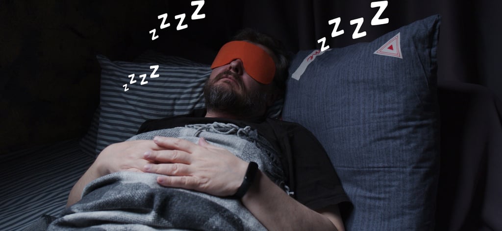Sleeping Man in Bed Sound Asleep Wearing a Sleep Mask