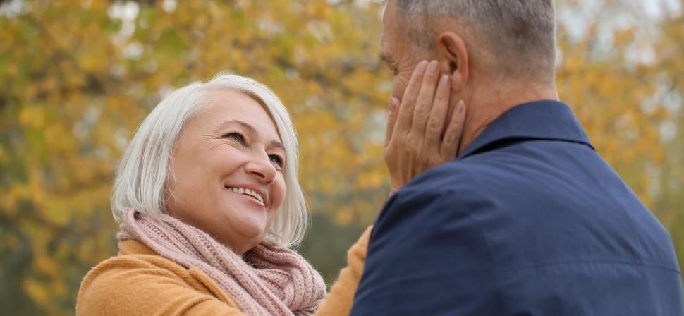senior couple in a park on a fall day