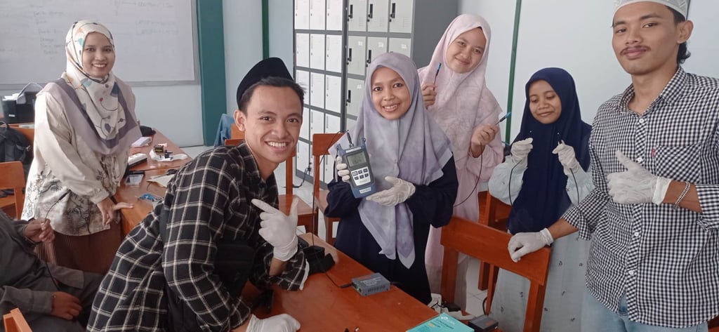 a group of people standing around a table