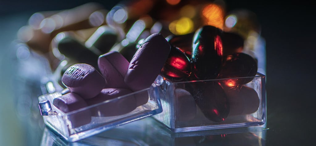 a glass container with a bunch of essential vitamin