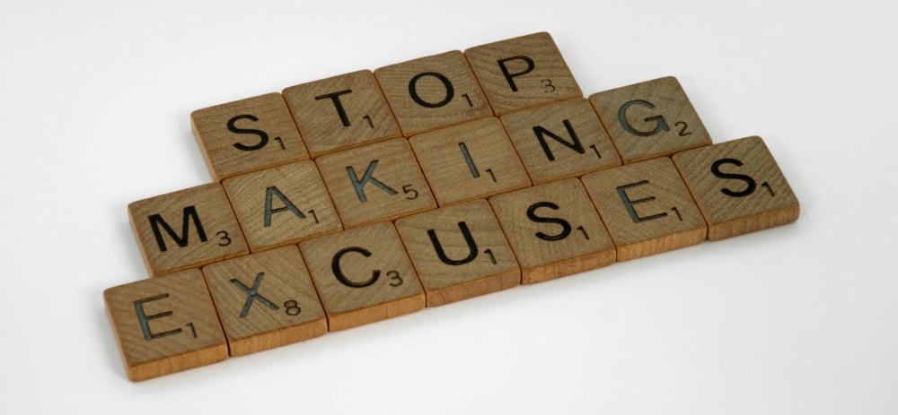 a wooden block with words that spell out the word stop making excuses