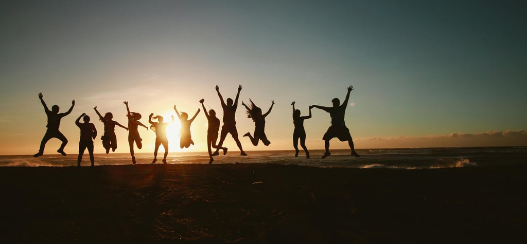 a group of people jumping in the air