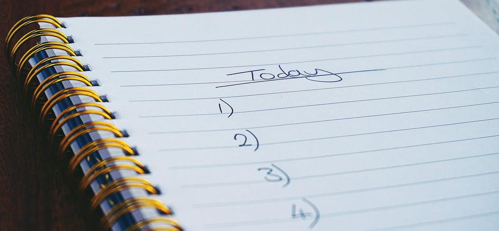 a notepad with a note pad and a pen on it