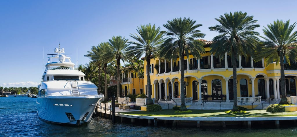 waterfront home with a yacht