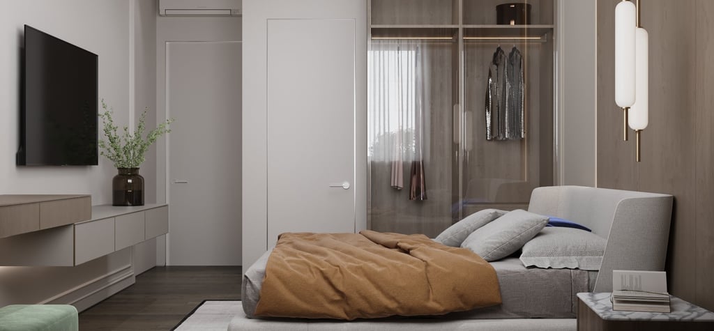 a bedroom with a bed and a television
