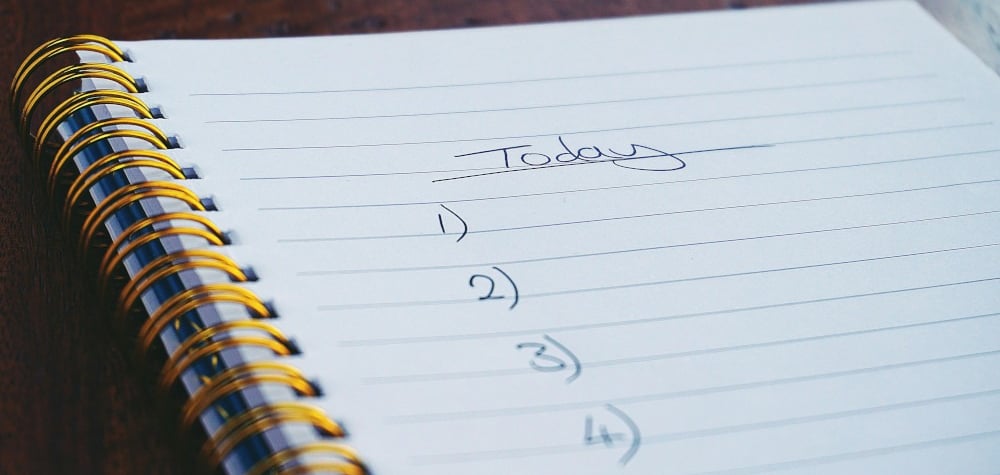 a notepad with a note pad and a pen on it