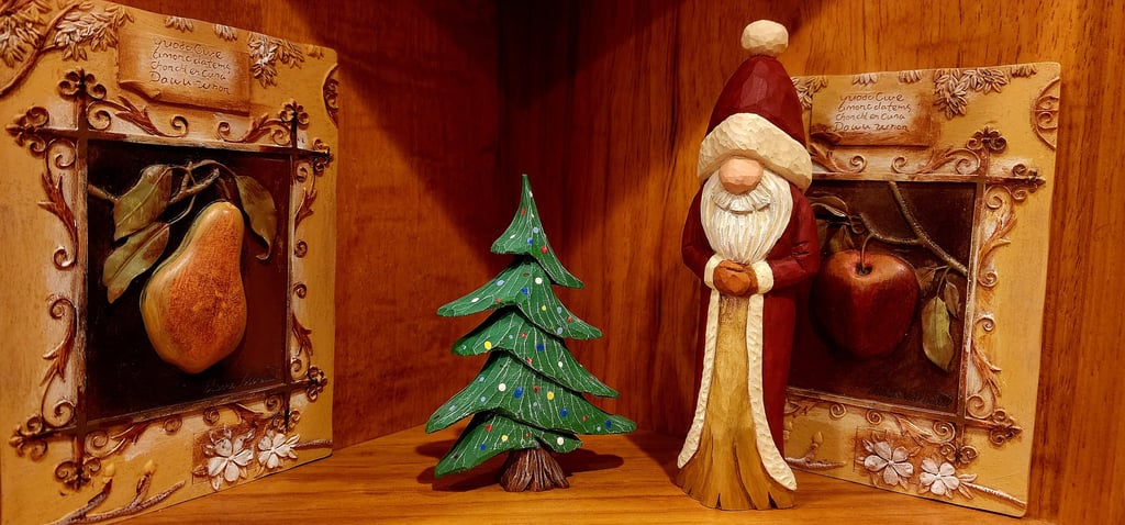 Santa in robe & xmas tree,.  Carved by James Smith