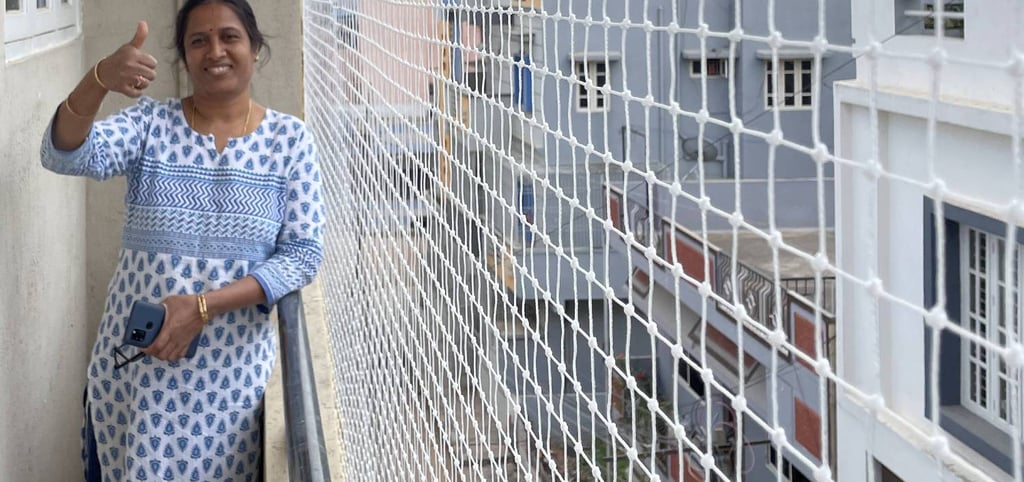 A close-up of a securely installed pigeon net on a high-rise balcony in Borivali East.