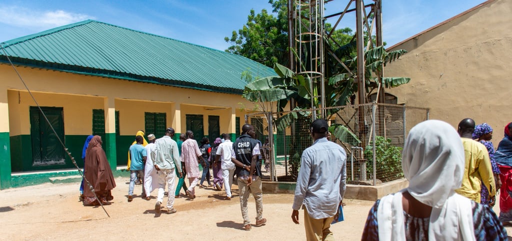 CHAD International staff leading learning facilitators to the training venue