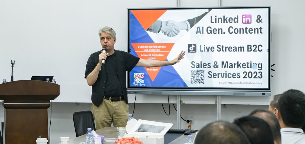 a man standing in front of a large screen