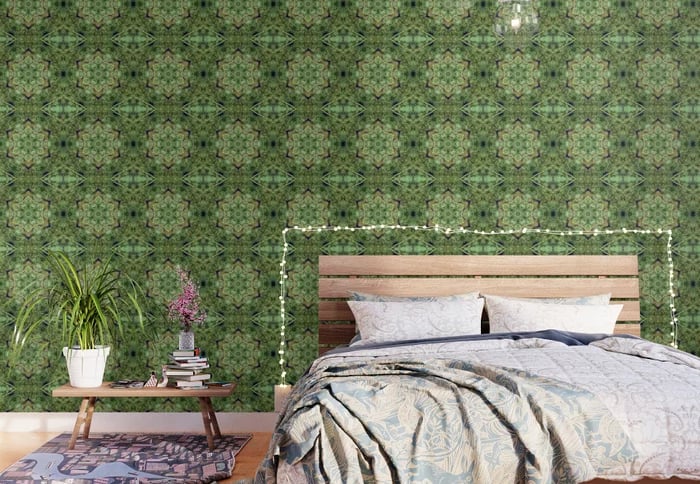 Abstract kaleidoscope print wall paper on a bedroom wall. 