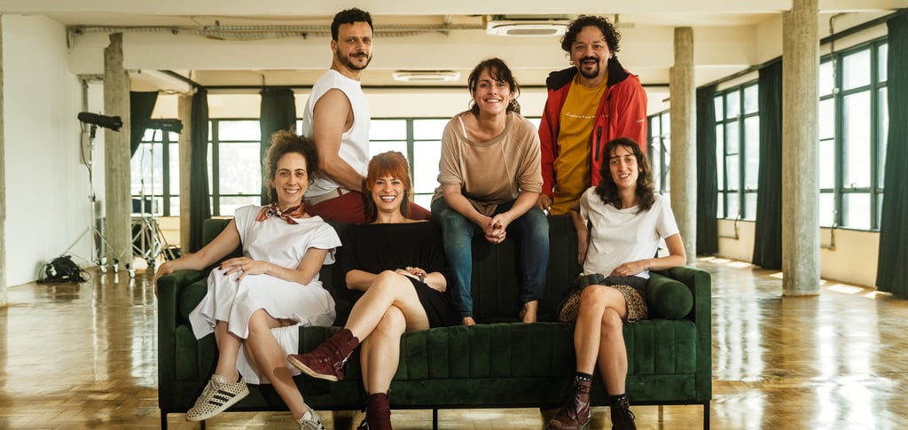 a group of people sitting on a couch in a room