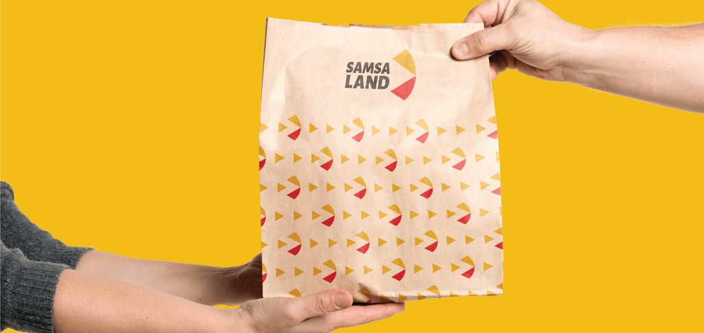 a person holding a bag of food in a bag