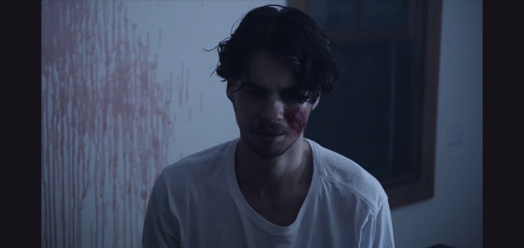 a man with a bloody face and a bloody face
