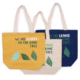 three tote bags with leaves on them