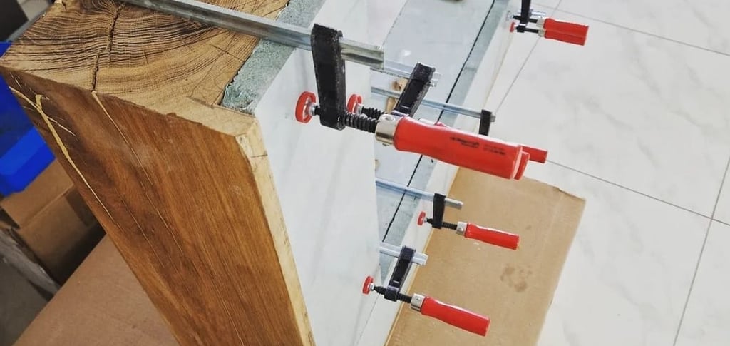 a clamped up to a table top with a clampe of tools