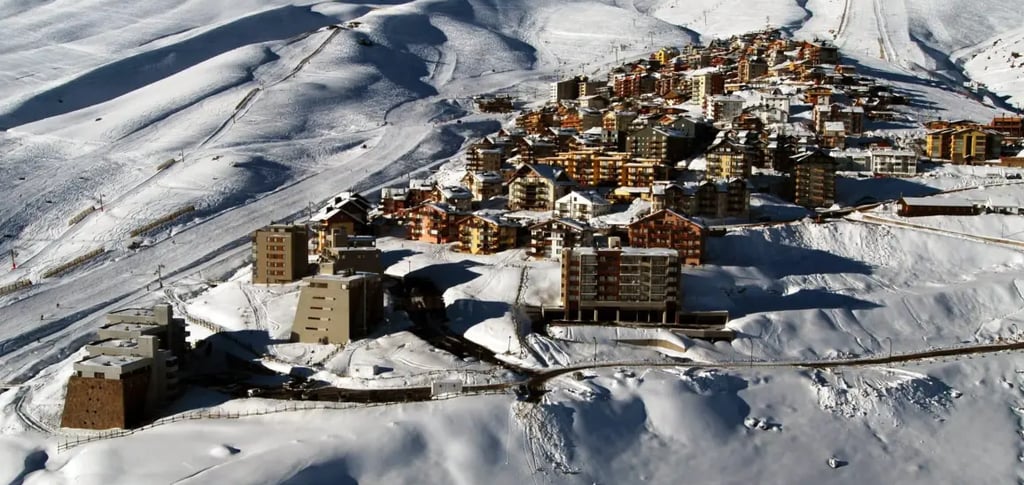 a mountaintop with a view of a La Parva chile