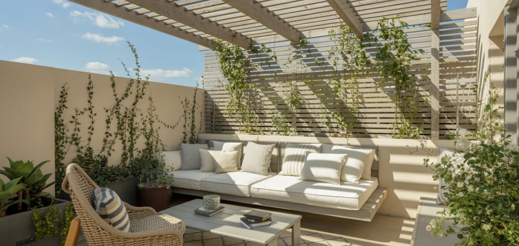 Pergola roof reading nook with slatted wood overhead, sunlight filtering through, climbing plants st