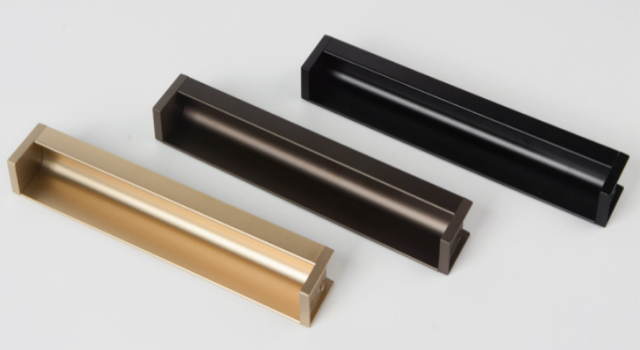 aluminum L-shape groove pull handle installed in a light oak wood cabinet, showcasing seamless flush slot-in design