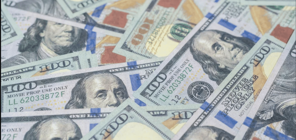 a bunch of money bills and dollars bills