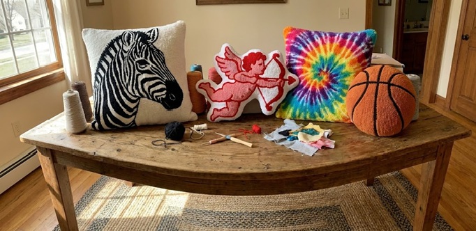 a table with a tufted pillows on it