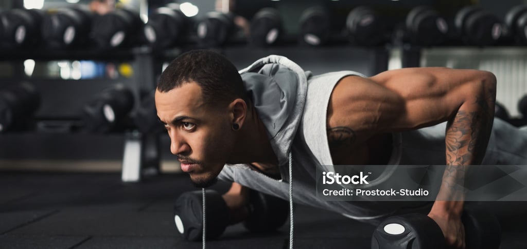 a man doing push ups in a gym