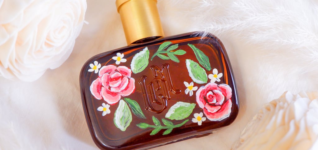 A perfume bottle painted with flowers by New York calligrapher and illustrator Handwritten by Belle.