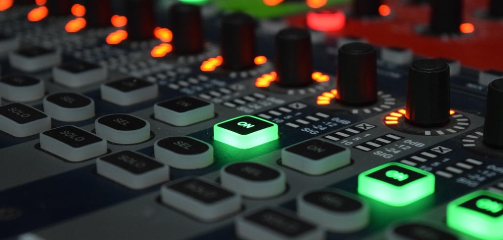 Control panel of an analog synthesizer with buttons, knobs, and LED lights.