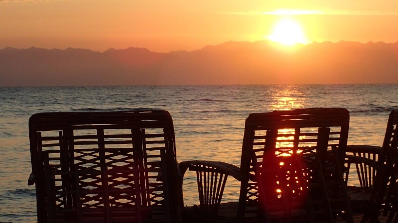 Bedouin star sunrise watching from chairs of the beach in Ras shitan Egypt