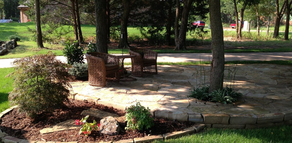 Landscape design and installation project in north Edmond, OK. Planting, patio, retaining wall