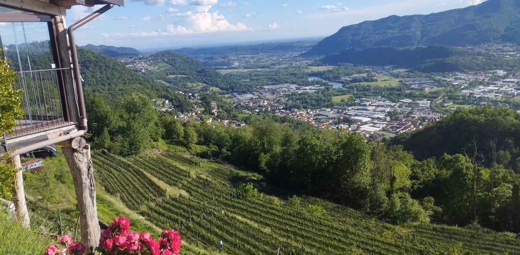 a view of a mountain range with a balcony and a balcony