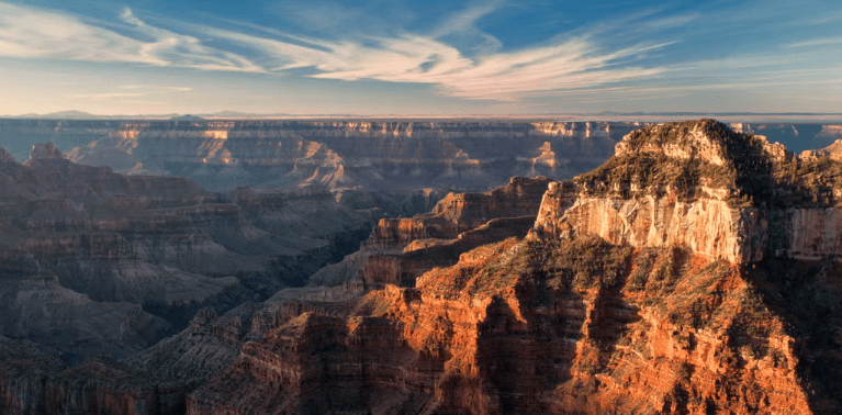 view of the Grand Canyon at sun rise and Why 2025 is the perfect year for US travel