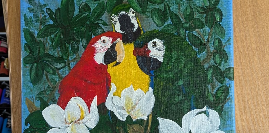 Finished canvas painting of 3 macaws in a magnolia tree.