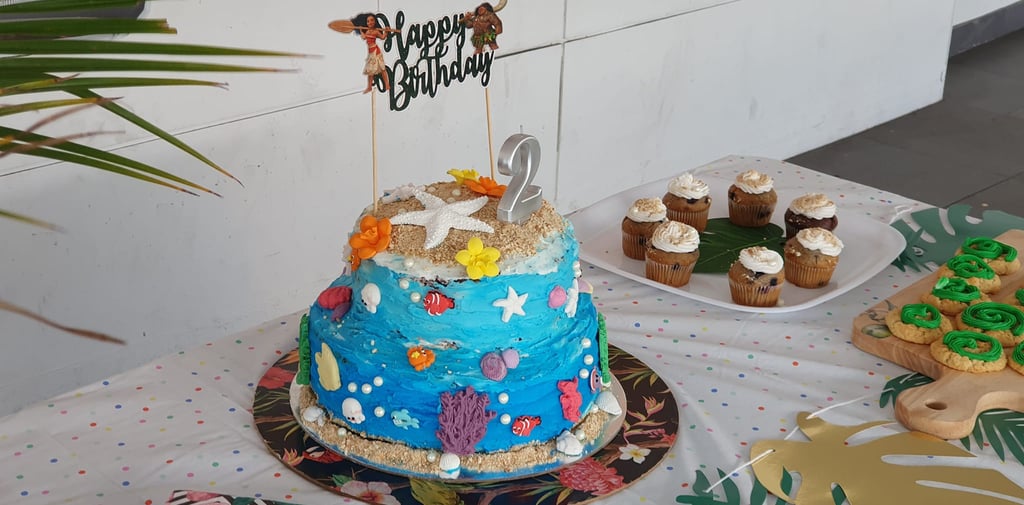 a cake with a blue and white cake topper