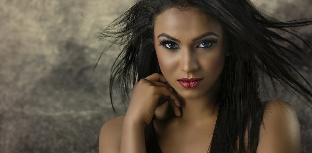 a woman with long hair and a black top