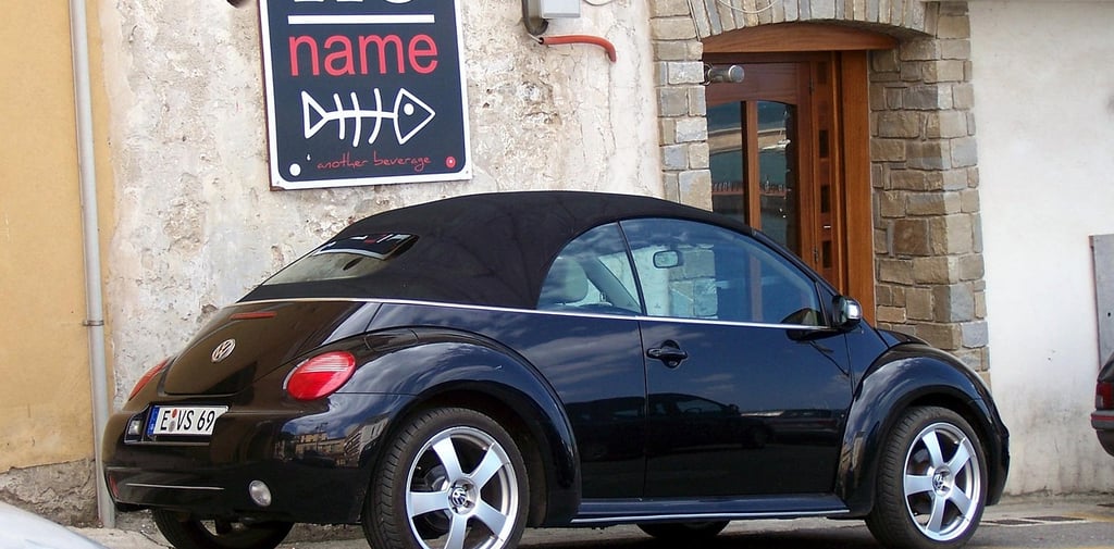 volks wagon infront of no name business name gen implication board