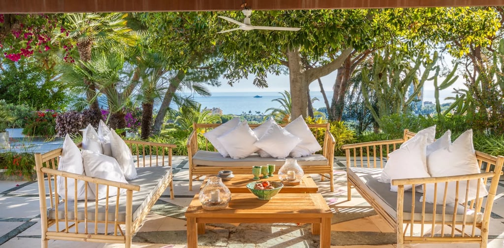 Covered terrace lounge with sea views and outdoor seating