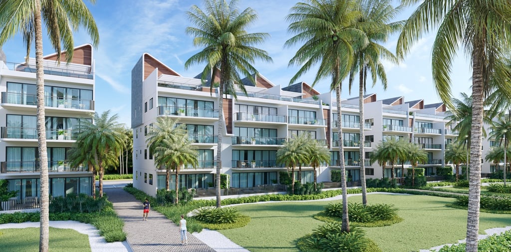 a large apartment complex with a lawn and palm trees