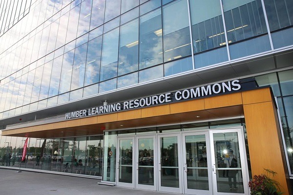 Exterior of Humber College with glass doors and entrance sign, symbolizing a gateway to global