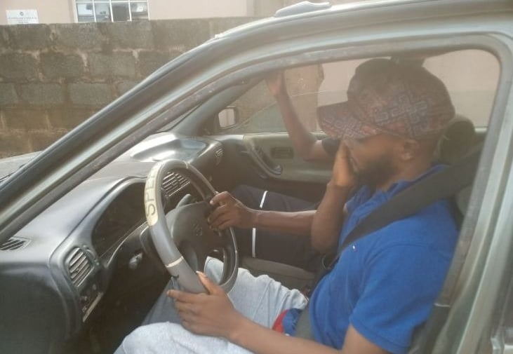 A student driver learning how to drive a a car at Triple A Global driving school in Lagos, Nigeria.