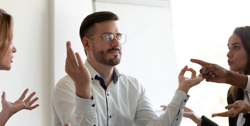Person staying calm instead of getting angry, even when surrounded by chaos