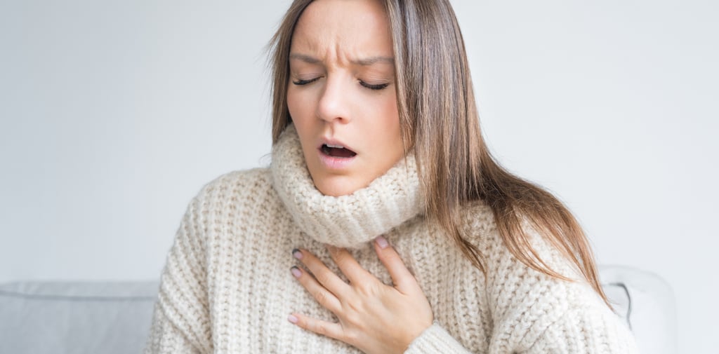 Woman having breath difficulties