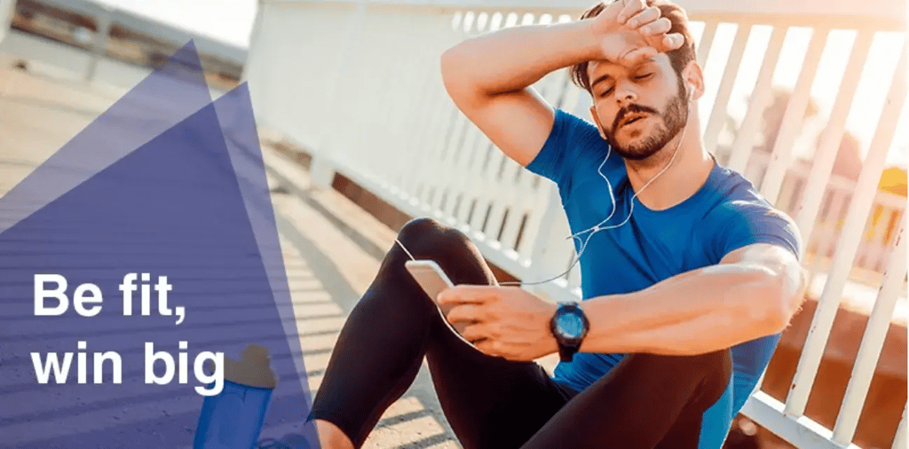 man sitting down mid jog, text 'be fit, win big'