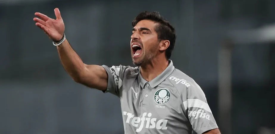 a soccer player is shouting at the camera
