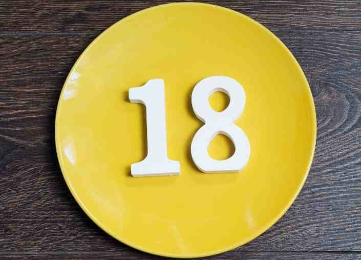 yellow plat with white numerals of 1 and 8