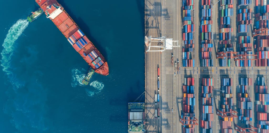 calculator and shipping documents showing total landed cost calculation for preserved flowers import